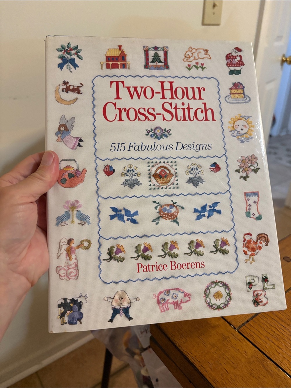 Two-Hour Cross-Stitch book — white cover with multicolor motifs